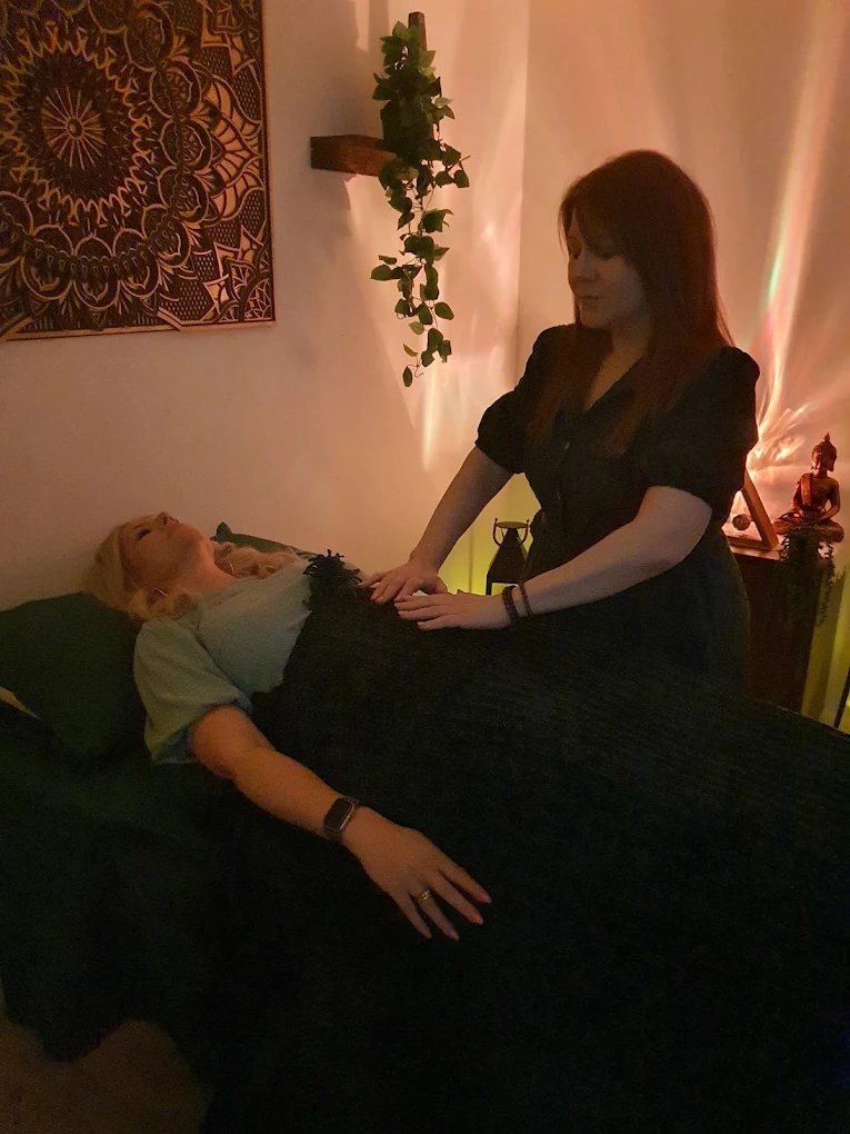 Emma giving a Reiki treatment in the treatment room at Middlewood Road